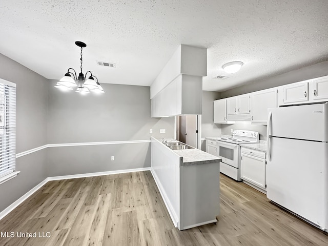 kitchen with sink, white cabinetry, decorative light fixtures, light hardwood / wood-style flooring, and white appliances