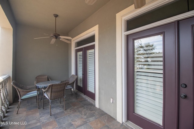 balcony featuring ceiling fan and a patio area