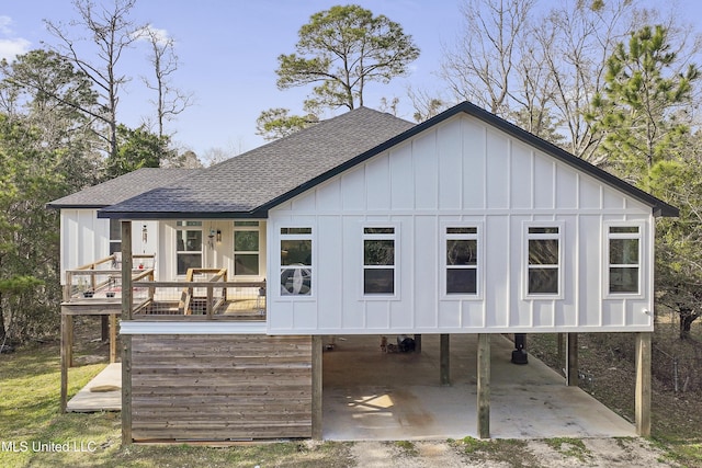 rear view of property featuring a carport