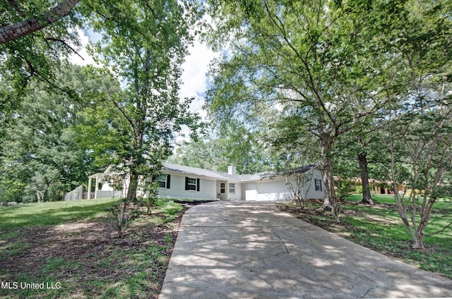 1201 Manchester Dr, Clinton, MS 39056 - single story home featuring driveway, a chimney, and a garage