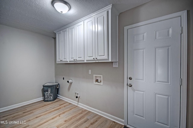 1201 Manchester Dr, Clinton, MS 39056 - laundry area with baseboards, a textured ceiling, gas dryer hookup, light wood-style flooring, and washer hookup