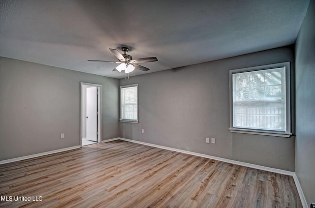 1201 Manchester Dr, Clinton, MS 39056 - spare room featuring baseboards, a ceiling fan, and wood finished floors