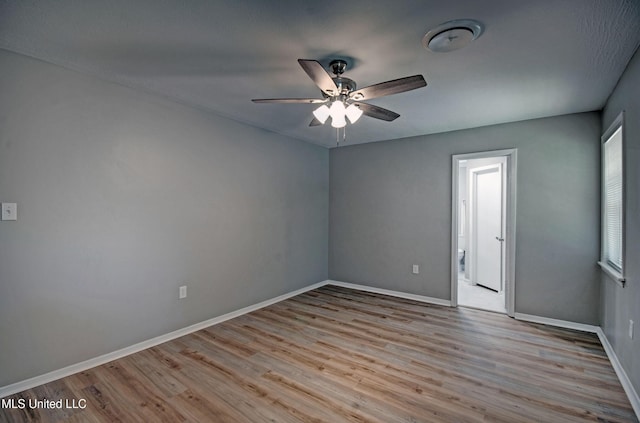 1201 Manchester Dr, Clinton, MS 39056 - empty room with baseboards, ceiling fan, and wood finished floors