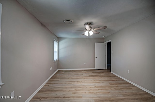 1201 Manchester Dr, Clinton, MS 39056 - empty room featuring a ceiling fan, baseboards, and wood finished floors