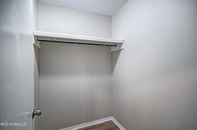 1201 Manchester Dr, Clinton, MS 39056 - spacious closet with dark wood finished floors