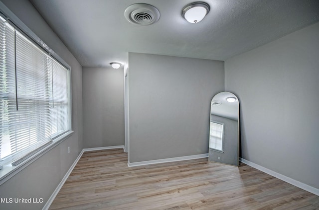1201 Manchester Dr, Clinton, MS 39056 - unfurnished room with baseboards, visible vents, and wood finished floors