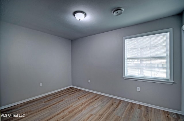 1201 Manchester Dr, Clinton, MS 39056 - empty room featuring baseboards and wood finished floors