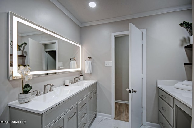 1201 Manchester Dr, Clinton, MS 39056 - bathroom with double vanity, a sink, marble finish floor, and ornamental molding