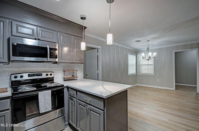 1201 Manchester Dr, Clinton, MS 39056 - kitchen with gray cabinets, appliances with stainless steel finishes, and tasteful backsplash