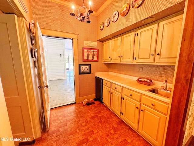 5010 Old Hwy 49, Clarksdale, MS 38614 - kitchen with a sink, brick patterned flooring, light countertops, a chandelier, and baseboards