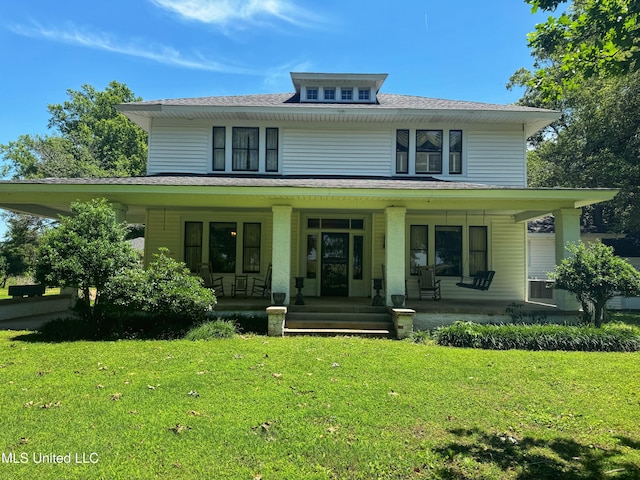 5010 Old Hwy 49, Clarksdale, MS 38614 - american foursquare style home with a porch, a front lawn, and roof with shingles
