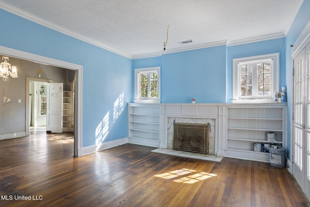 unfurnished living room with visible vents, crown molding, a fireplace, and hardwood / wood-style flooring