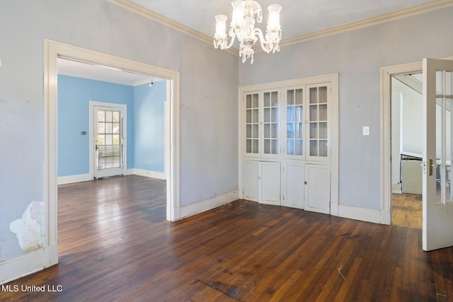 unfurnished dining area featuring hardwood / wood-style floors, baseboards, and ornamental molding