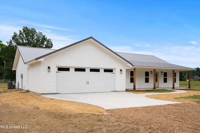 ranch-style home featuring a porch, central air condition unit, and a garage