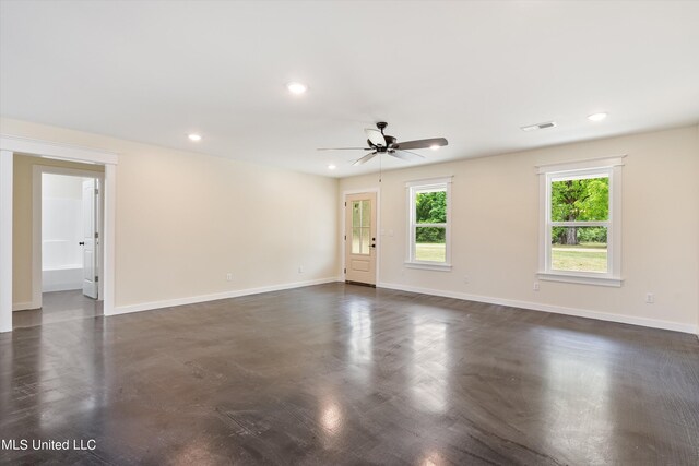 empty room featuring ceiling fan and dark hardwood / wood-style floors