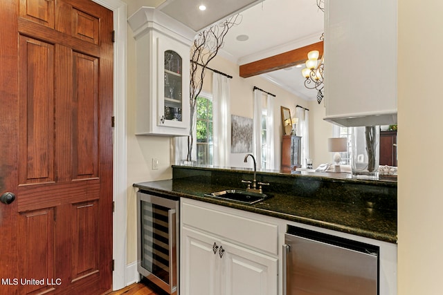 bar featuring crown molding, sink, dark stone counters, white cabinets, and wine cooler