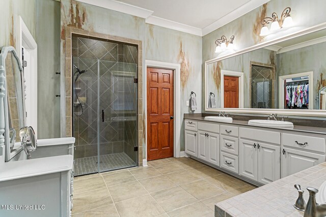 bathroom featuring vanity, ornamental molding, a shower with shower door, and tile patterned flooring