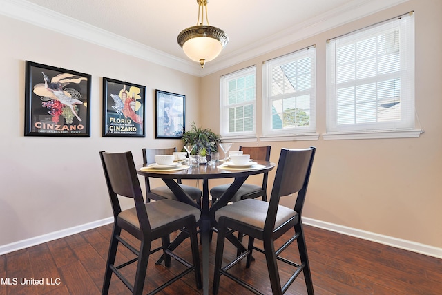 dining area with dark hardwood / wood-style flooring and ornamental molding