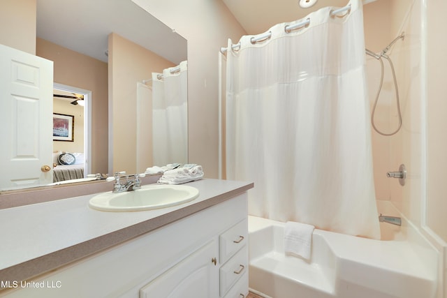 bathroom featuring vanity, ceiling fan, and shower / bath combo with shower curtain