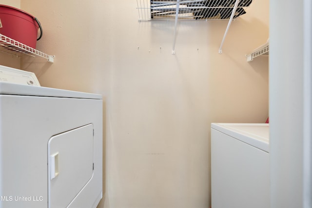 washroom featuring independent washer and dryer