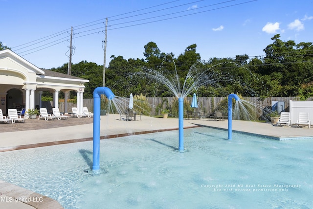 view of swimming pool featuring a patio area