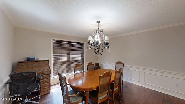 136 Westlake Dr, Brandon, MS 39047 - dining room featuring a chandelier, dark wood-style flooring, crown molding, and wainscoting