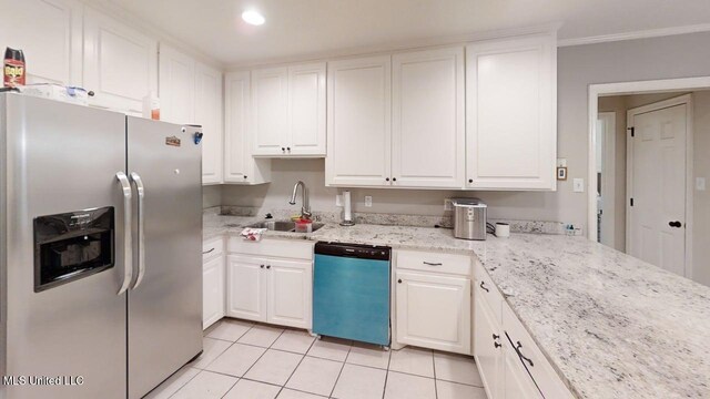 136 Westlake Dr, Brandon, MS 39047 - kitchen with stainless steel fridge, dishwasher, a sink, light tile patterned floors, and white cabinetry