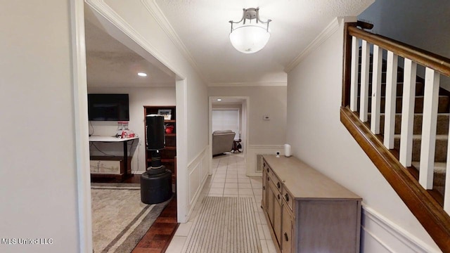 136 Westlake Dr, Brandon, MS 39047 - hallway featuring stairway, light tile patterned floors, and ornamental molding