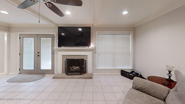 136 Westlake Dr, Brandon, MS 39047 - tiled living area with french doors, a ceiling fan, crown molding, recessed lighting, and a fireplace with raised hearth