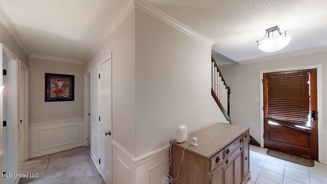 136 Westlake Dr, Brandon, MS 39047 - entryway featuring a decorative wall, stairs, ornamental molding, wainscoting, and light tile patterned floors
