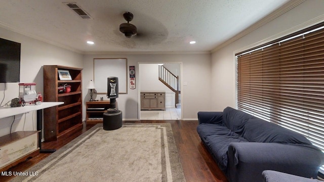 136 Westlake Dr, Brandon, MS 39047 - living room featuring wood finished floors, recessed lighting, crown molding, stairway, and a textured ceiling