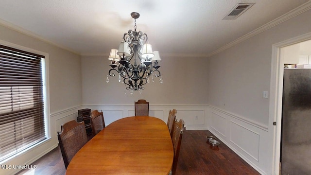 136 Westlake Dr, Brandon, MS 39047 - dining area featuring wood finished floors, a chandelier, ornamental molding, and a wainscoted wall