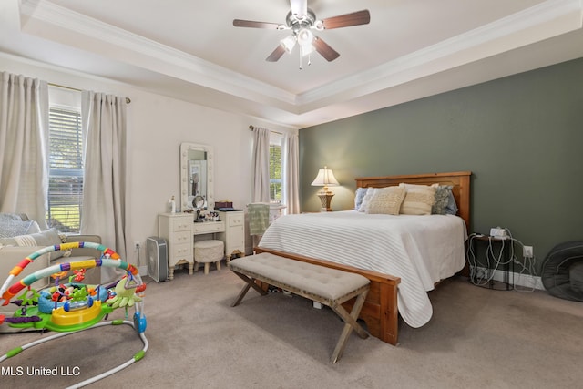 22807 Alamosa Dr, Moss Point, MS 39562 - bedroom with a tray ceiling, light carpet, a ceiling fan, and ornamental molding