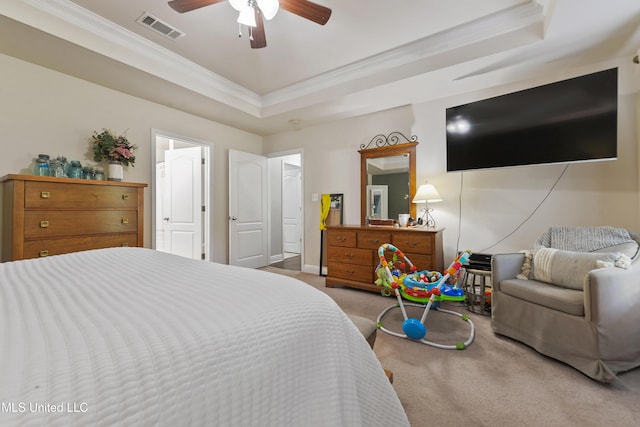22807 Alamosa Dr, Moss Point, MS 39562 - bedroom with a raised ceiling, crown molding, carpet floors, visible vents, and ceiling fan