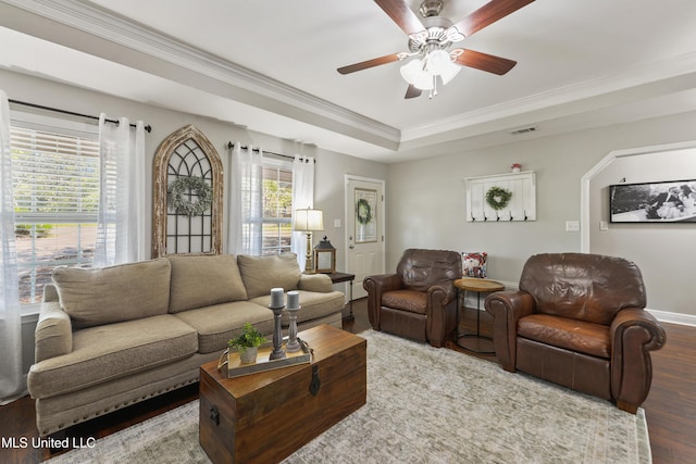 22807 Alamosa Dr, Moss Point, MS 39562 - living area with ornamental molding, a ceiling fan, visible vents, a raised ceiling, and wood finished floors