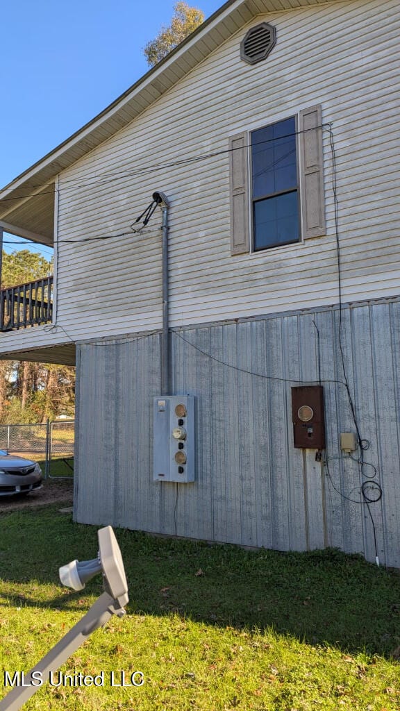 view of home's exterior with a yard