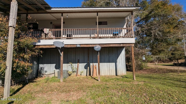 back of property with cooling unit and a yard