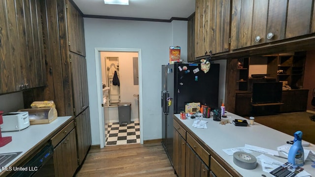 kitchen featuring ornamental molding and light wood-type flooring