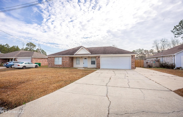 ranch-style house with a garage and a front yard