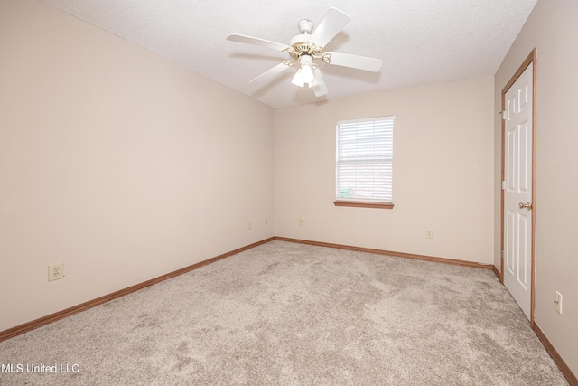 unfurnished room featuring light carpet, a textured ceiling, and ceiling fan