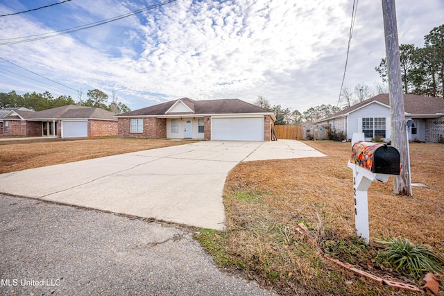 ranch-style home with a garage and a front yard