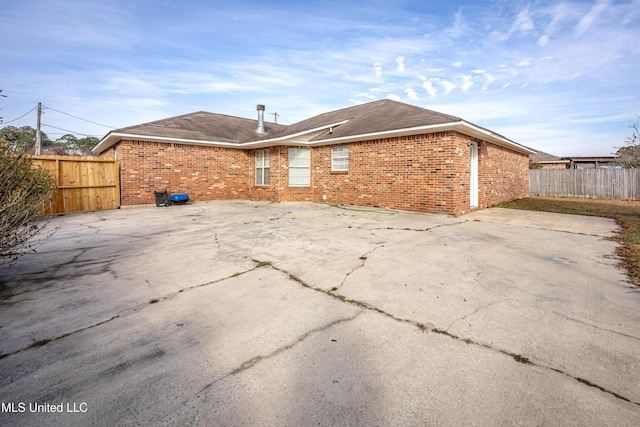 rear view of property featuring a patio