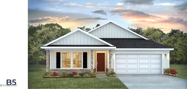 view of front of property featuring a yard and a garage