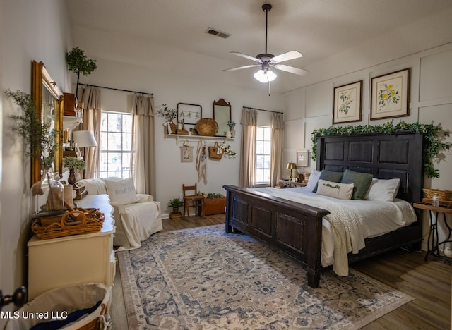 bedroom with hardwood / wood-style floors and ceiling fan