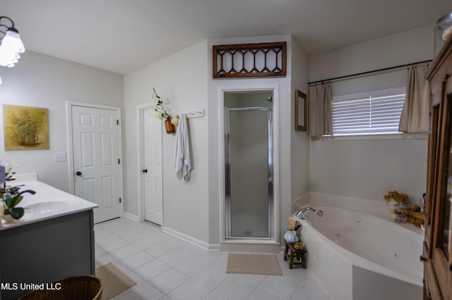 bathroom with tile patterned flooring, vanity, a textured ceiling, and shower with separate bathtub