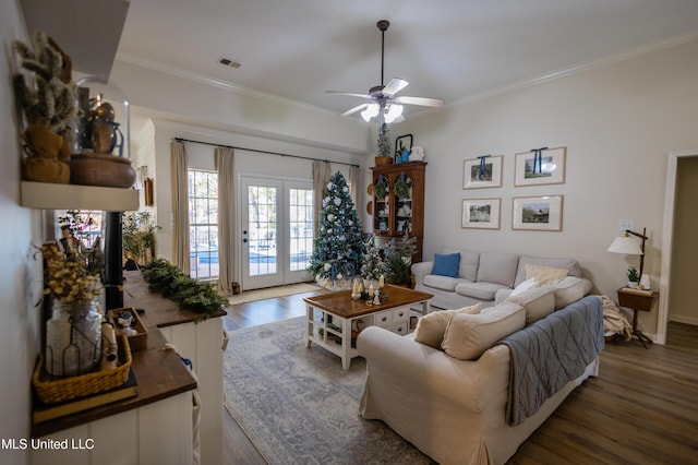 living room with ceiling fan, dark hardwood / wood-style flooring, french doors, and ornamental molding