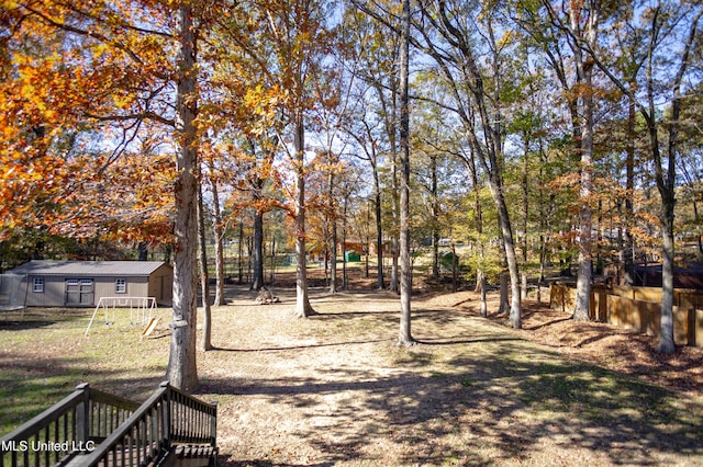 view of yard featuring an outbuilding and a playground