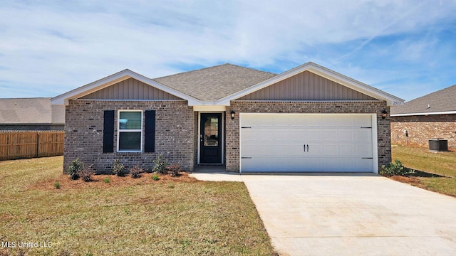 view of front of property with fence, a front lawn, central AC, and concrete driveway