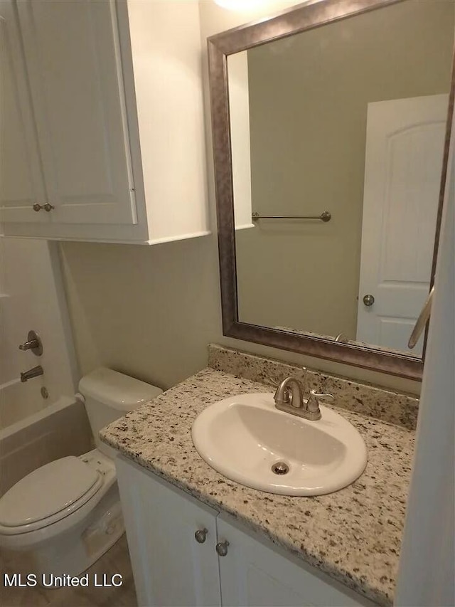 full bath with toilet and vanity