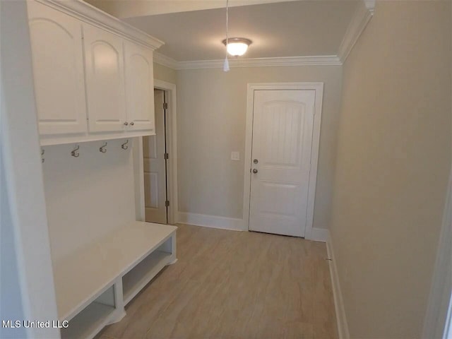 mudroom with crown molding, baseboards, and light wood finished floors